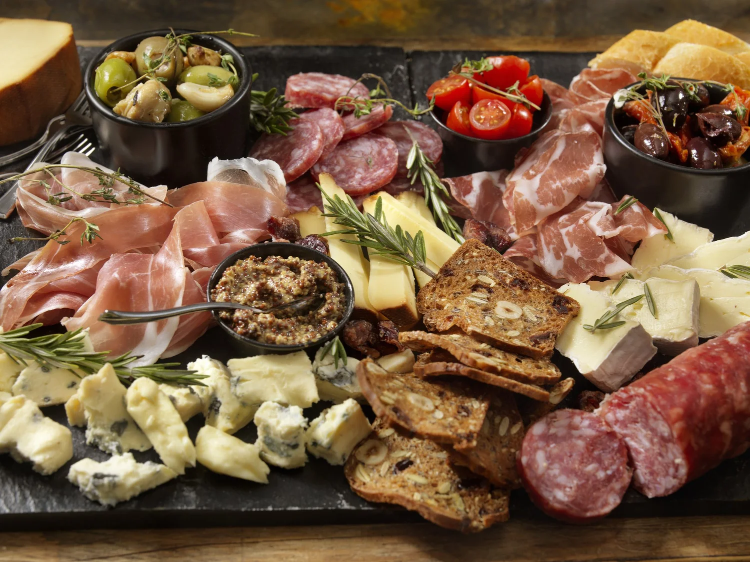 A generous family-style charcuterie board prepared for an event